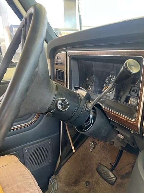 Damaged steering wheel column and dashboard of the motorhome.