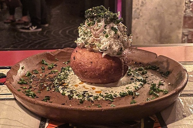 The "corn crab doughnut": a savory masa donut topped with blue crab salad and caviar