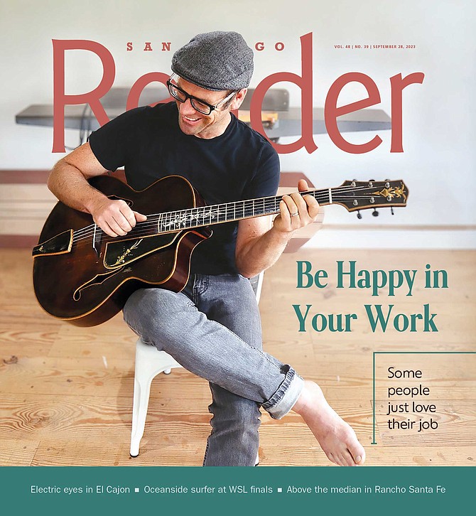 Taylor Guitars leader Andy Powers with a guitar he built using 100-year-old materials and 100-year-old tools.
