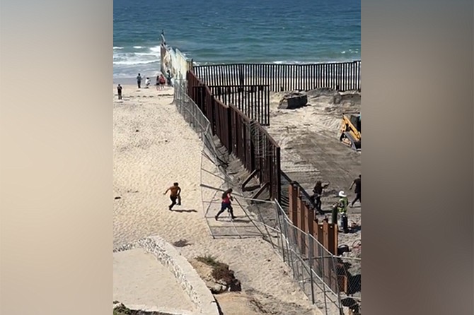 Immigrants are welcomed to America at the newly opened Beach Border Pedestrian Crossing.