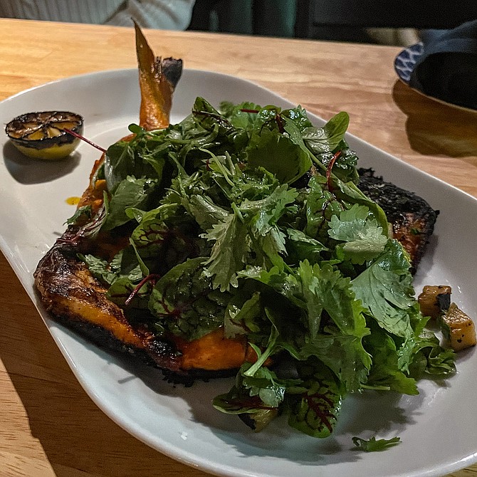 Ensenada sourced seabass, butterflied and grilled with achiote, grilled pineapple, and herbs including cilantro and radicchio