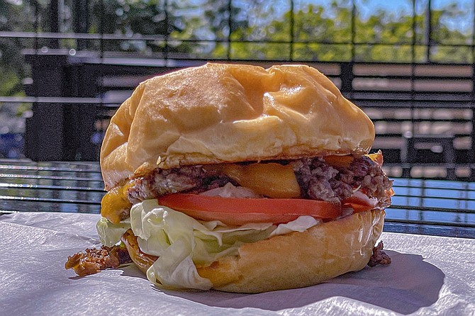 A smashburger, served on a house bun at Burger Deck