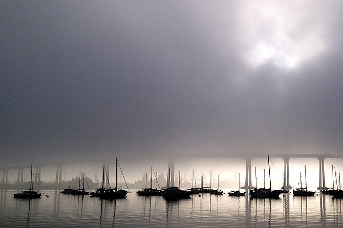 A fog bank engulfs the Coronado bridge on an early October morning.