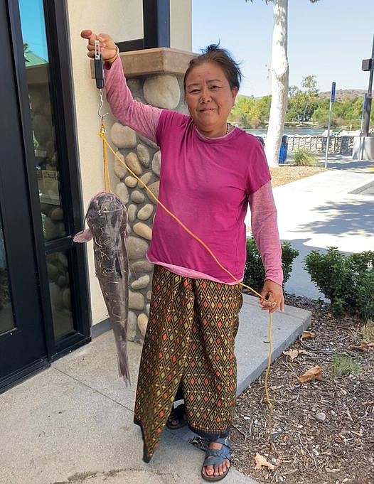 The winner for the largest catfish caught over Stockzilla weekend at Santee Lakes, Phat Khaleck, with her 9-pound, 8-ounce channel catfish.