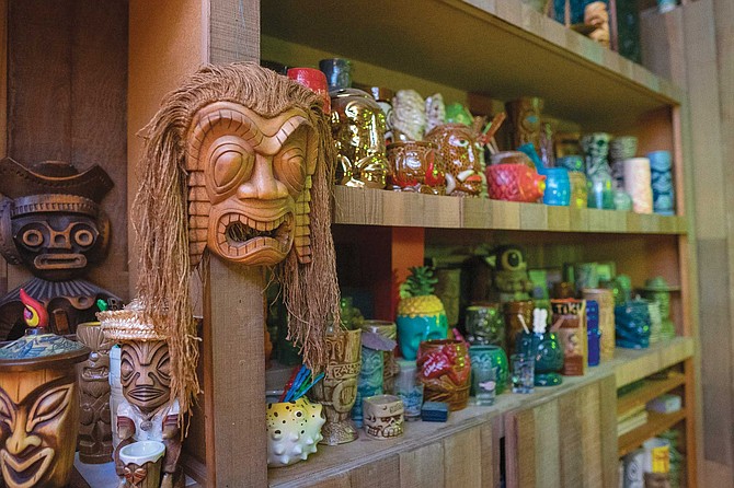 One room in Meyer’s house is dedicated to all things tiki. “When we bought our home, one small bedroom came with wood paneling and shelves, so that became our tiki room,” he says.
