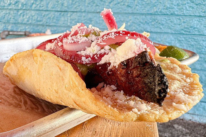 A cochinita pibil styled taco, featuring pork belly
