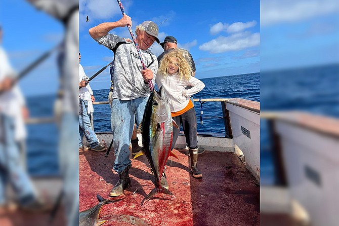 A happy young angler with a nice yellowfin tuna caught aboard the Old Glory 2-Day run out of H&M; Landing as fall fishing continues to impress.