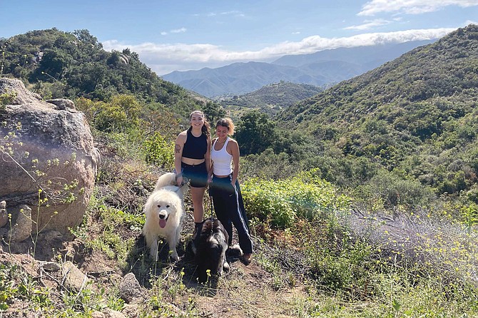 Sophie and Caroline out on a hike with two of Athena’s dogs.