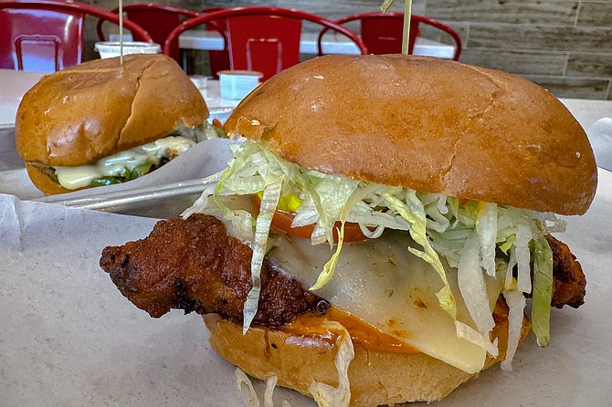 A spicy chicken slider (right), and Philly cheesesteak slider (left)