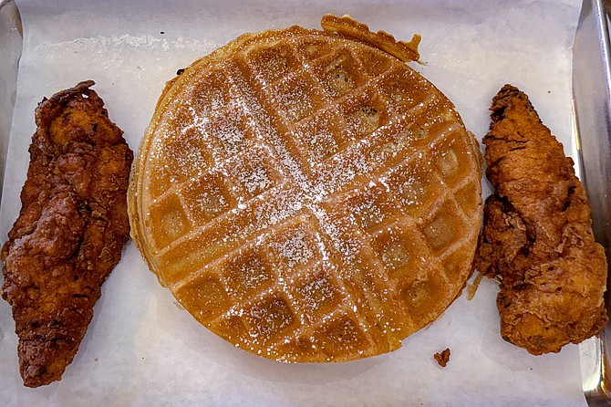A two-piece chicken and waffle