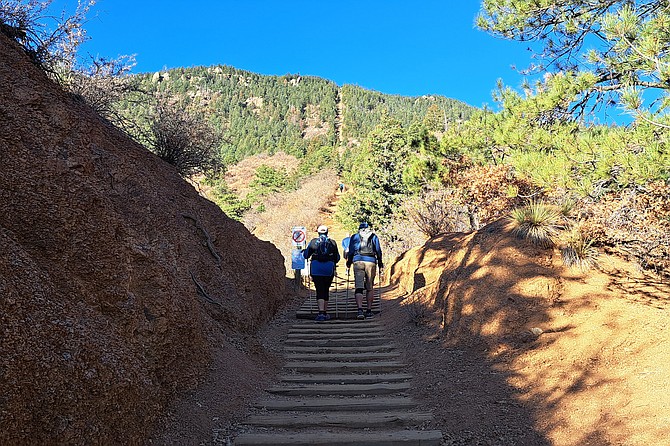 Two hikers heading up the incline