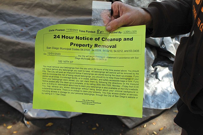 “When homeless people see the green notices, they know they have to move their belongings,” says homeless advocate Michael McConnell.