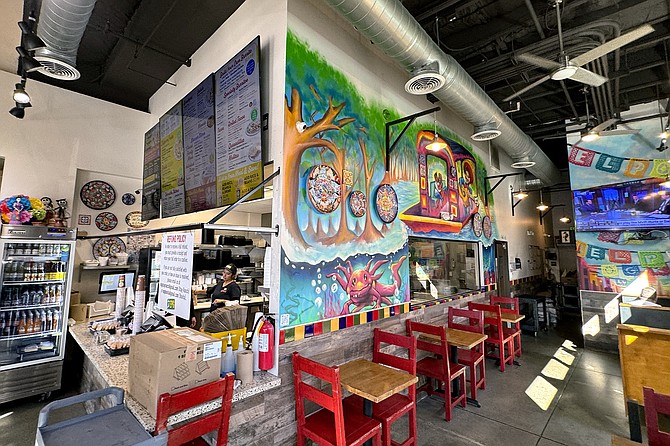 A colorful take out shop and small dining room in Bonita
