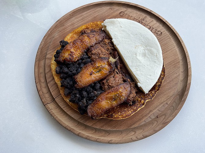 Sweet-savory paradise - Fried plantains, black beans, beef and cheese make potent mix.