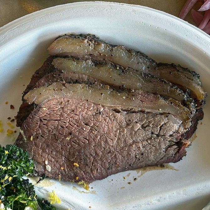Slices of smoked picanha, likened by the chef to a "carne asada steak"