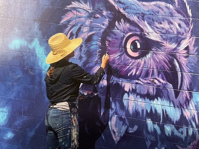 Hanna at work on one of her most popular subjects, the owl.
