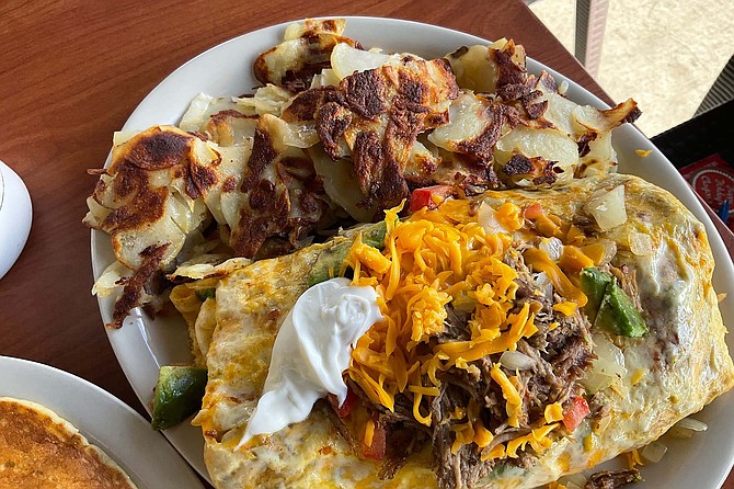Fiesta omelet: $19.95 with shredded beef, potatoes, pancakes. No bacon, still worth it.