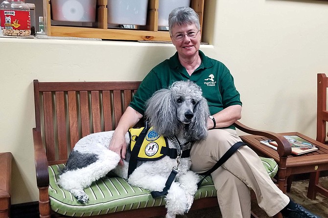 Pawsitive Teams’ executive director, Eileen Heveron, with her diabetic alert dog, Dex.