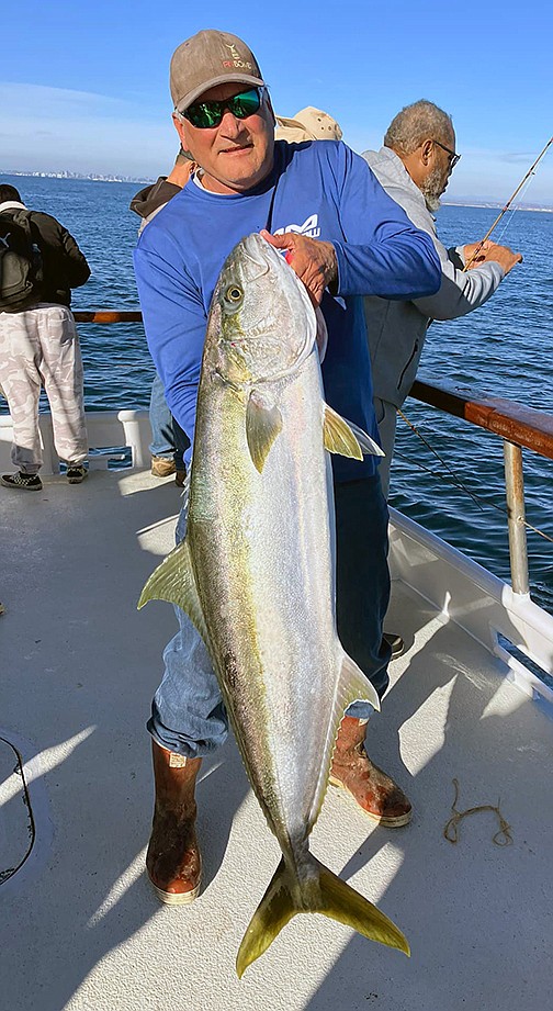 Rob Tressler with his 40-pound yellowtail caught while fishing for sand bass aboard the Premier afternoon half day run.