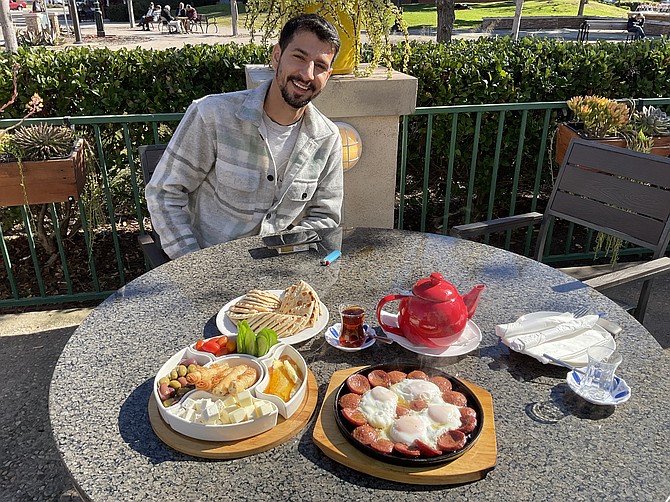 Breakfast companion - Mirza with his breakfast.