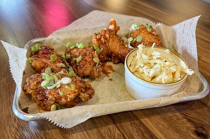 Twice-fried Sweet & Spicy chicken wings, flavored with the Korean chili paste gochujang