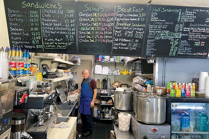 Surrounded by pots of eggs, bananas and broths, Manoli Antonakakis is a one-man miracle-worker