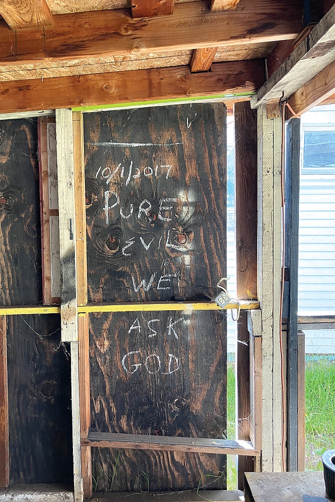 The walls were intact. But they were just bare drywall panels and there were random bits of writing scrawled all over.