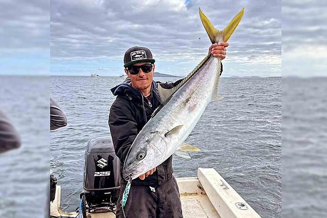 Cristian Catian of K&M Sportfishing in San Quintin with a quality yellowtail during a wide-open bite.