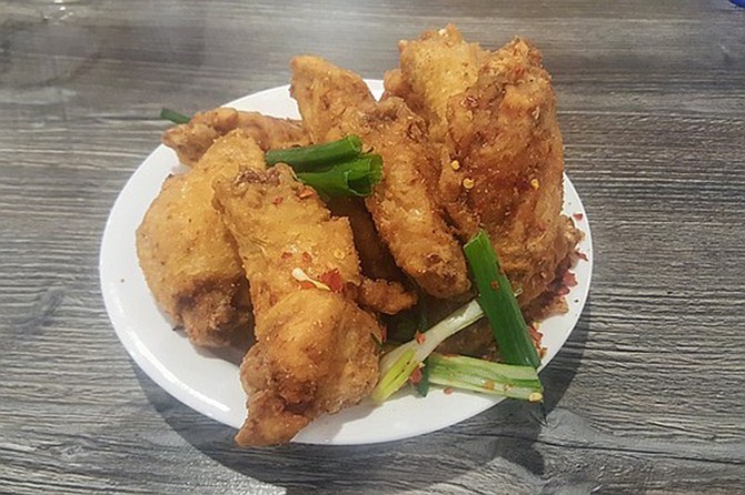Pepper chicken wings are just one of the dishes you might enjoy on the International food tour of National City.
