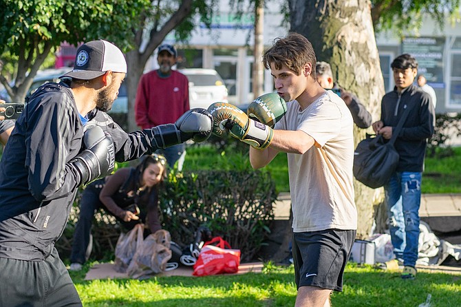 The first fight was between El Güero and a guy with a backward cap. - Image by Matthew Suárez