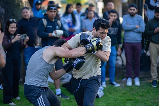 The guy with heaering aids found another opponent in better shape and received a beating.