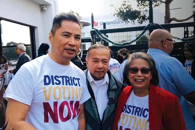 Audie de Castro (left) at rally for district-based elections in National City.