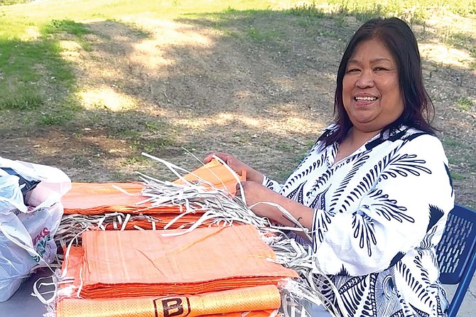 JoAnn Fields, Government and Public Relations Director, API Initiative, assisting distribution of sandbags at MLK Park and Recreation Center.
