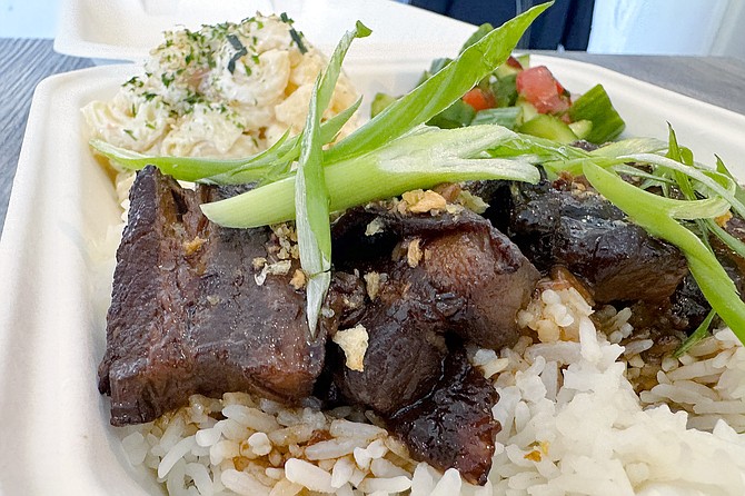 Pork belly adobo plate, served with macaroni salad and cucumber salad