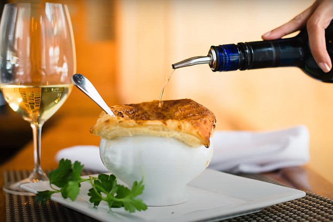 Finishing touch: Pouring the sherry into the hot mussel bisque.