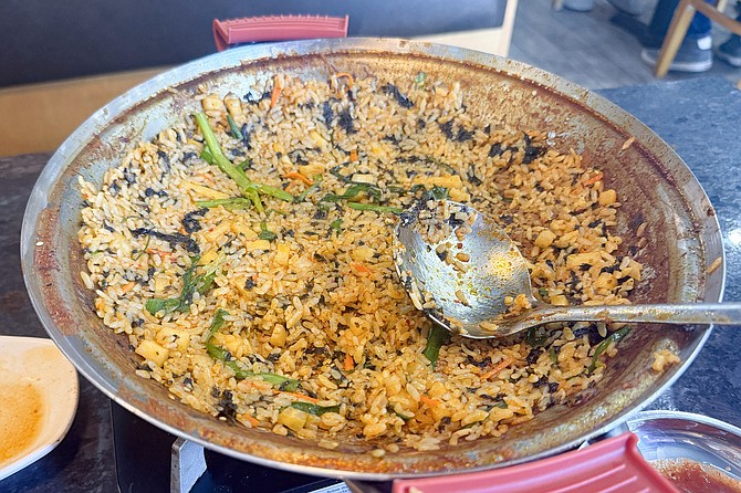 After the stew is done, the remaining broth is used to cook fried rice