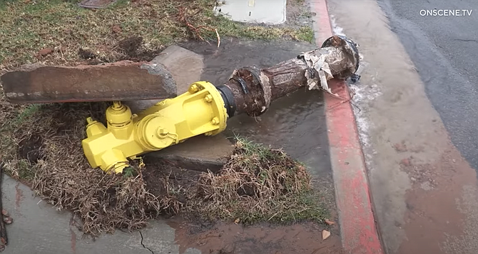 The University City hydrant was "ripped from the ground, and water spewed approximately 40 feet into the air."