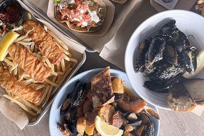 Affordable prices at Surfside Fish House encourage tables covered in seafood