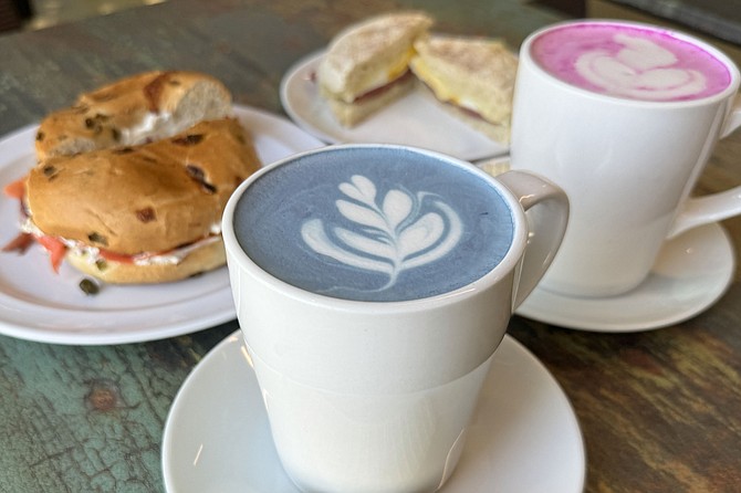 Breakfast sandwiches and matcha lattes flavored/colors with butterfly pea flower and dragonfruit