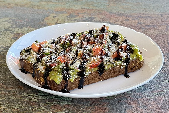 Avocado toast with tomatoes and balsamic vinegar