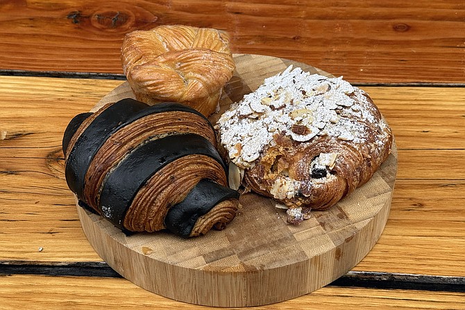A striped, Moroccan black olive and French chocolate croissant; sugar topped almond-chocolate croissant; and Tahitian vanilla knot
