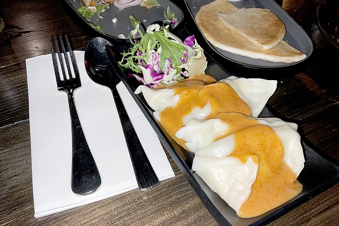 Shanghai dumplings with panang curry sauce.