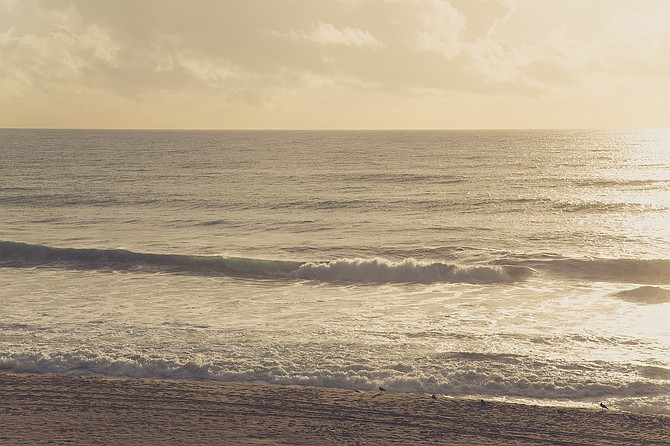 I love the surprise of occasionally seeing clouds hanging over the beach.