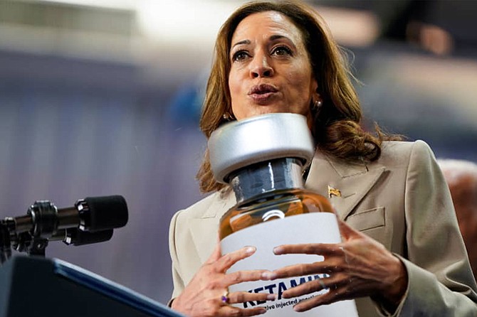 Kamala Harris, holding aloft the actual bottle of Ketamine that contained the lethal overdose that killed actor Matthew Perry and declaring, “Never again will a celebrity, or anyone else for that matter, be subject to the untrammeled greed of a medical industry that puts profits before patients.”