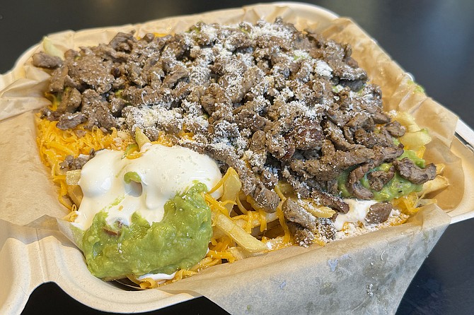 A large carne asada fries—more than a pound and a half of food from Lolita's Mexican Food