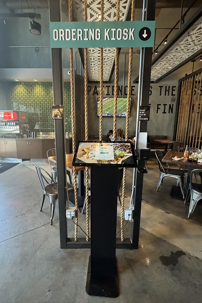 A touchscreen to order carne asada fries, rolled tacos, California burritos... the classics
