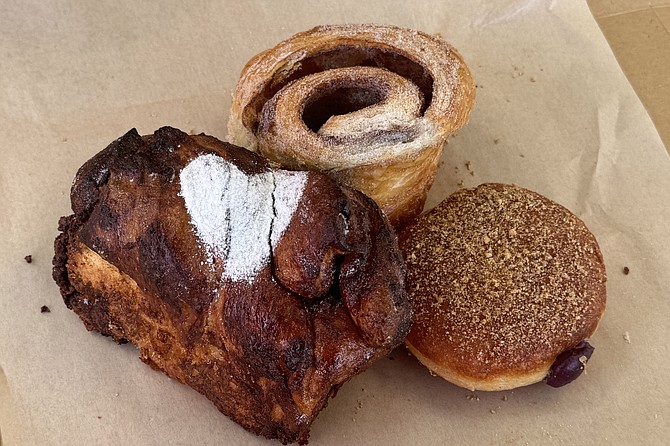A chocolate hazelnut babka, morning bun, and blueberry cheesecake filled donut