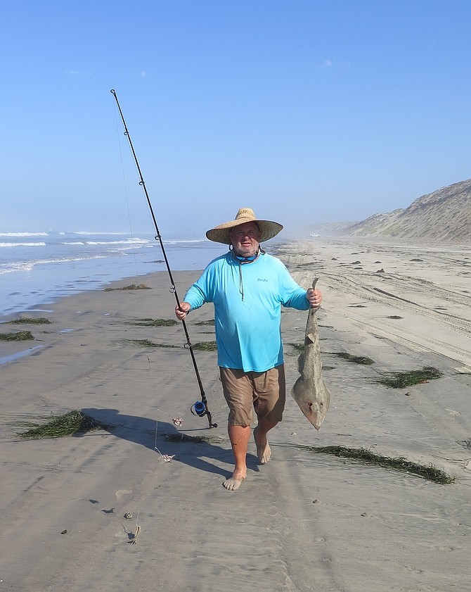Christian Seelicke with his third-place shovelnose sand shark in the Pioleros del Valle de San Quintin surf fishing Tournament.