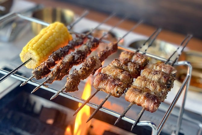 Left to right: corn, lamb, and pork belly-wrapped mushrooms