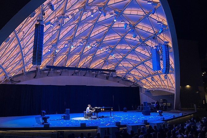 Ben Folds, surrounded by folded paper dreams.